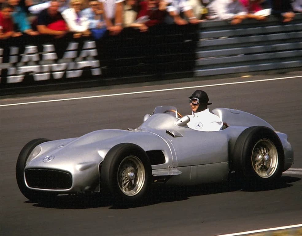 Juan Manuel Fangio driving a Mercedes-Benz W196 at a historic event in 1986